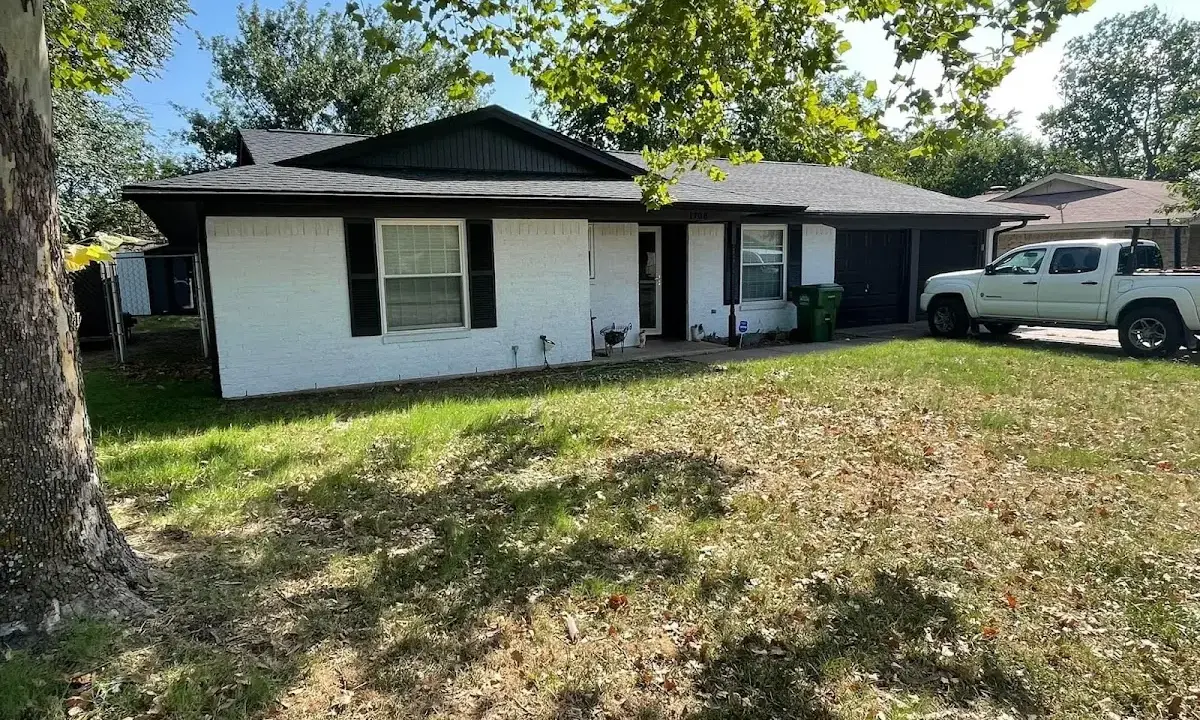 Professional roofing crew working on a residential roof in River Grove
